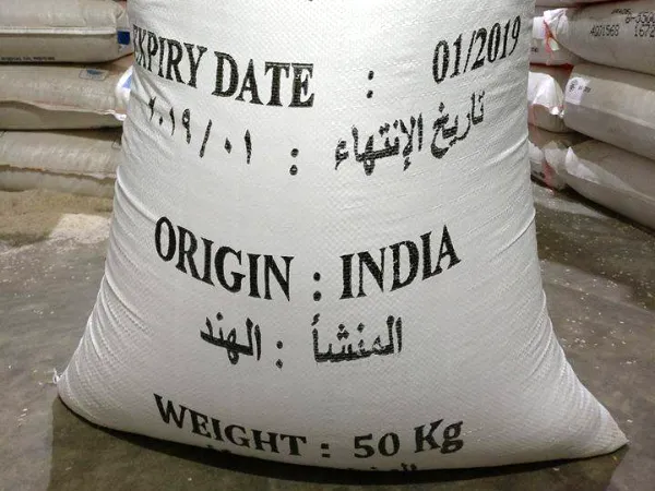 White 50 kg PP rice bag printed with buyer marking in English and Arabic: expiry date, origin India, weight 50 kg